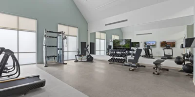 A well-equipped fitness gym with exercise machines.