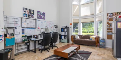 Office space with desks and a couch.