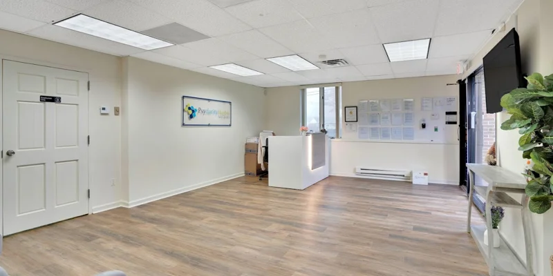 Lobby with a reception desk and seating.