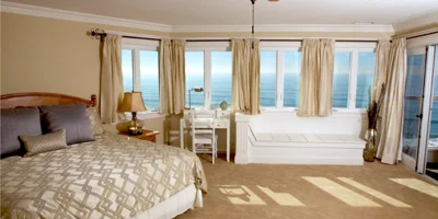  Spacious bedroom with ocean-facing windows.