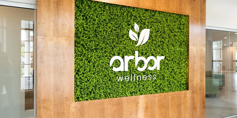 Arbor wellness signage at entrance to facility.
