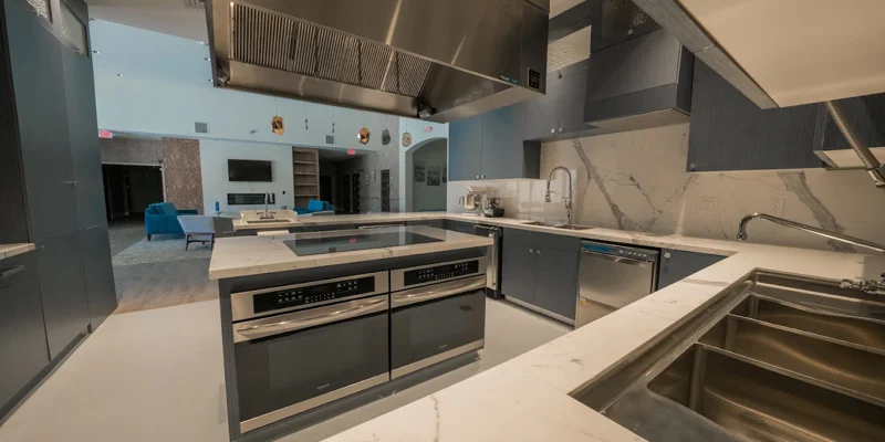Stylish kitchen with blue cabinetry and high-end finishes.