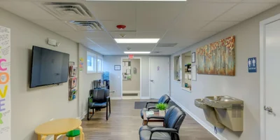 Lobby with chairs and reception desk.