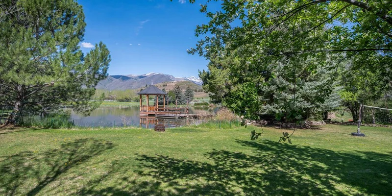 Lakeside gazebo with a field newrby.