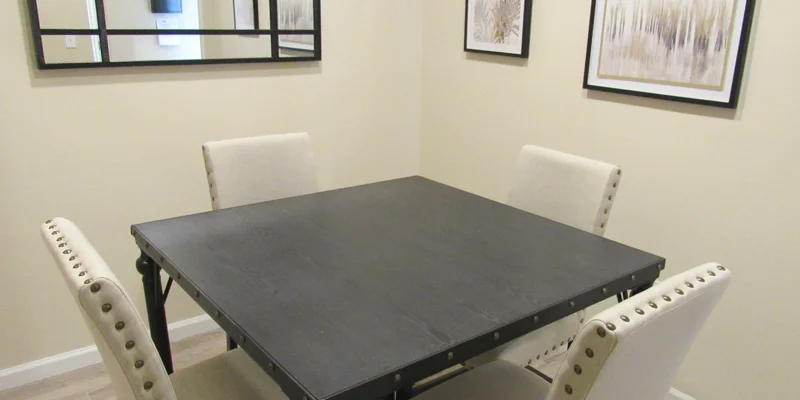 A small meeting room with a black table