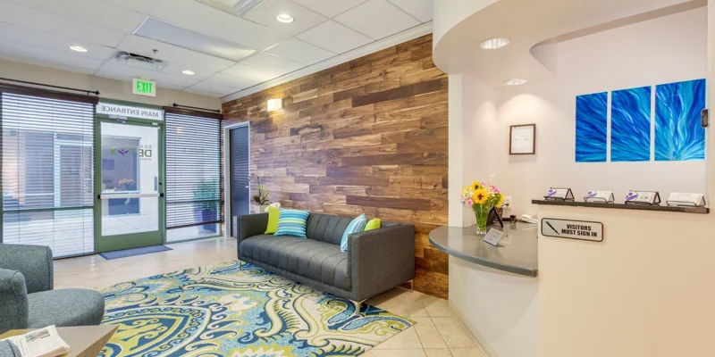Waiting area with seating by the reception.