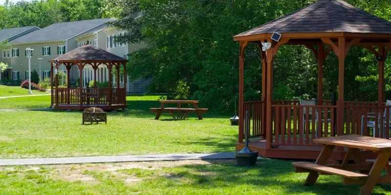 Outdoor view with gazebos and picnic tables.