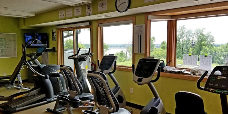 Workout area with treadmills and stationary bikes.