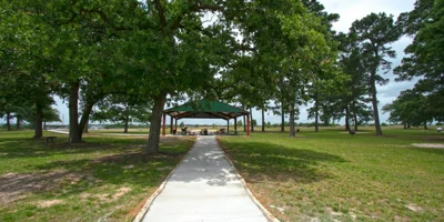 Outdoor pathway leading to a shaded pavilion.