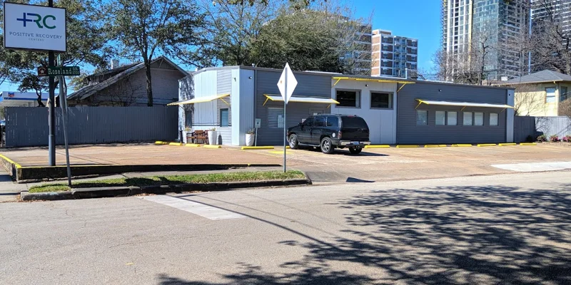 Exterior of Positive Recovery Centers with a parking lot.