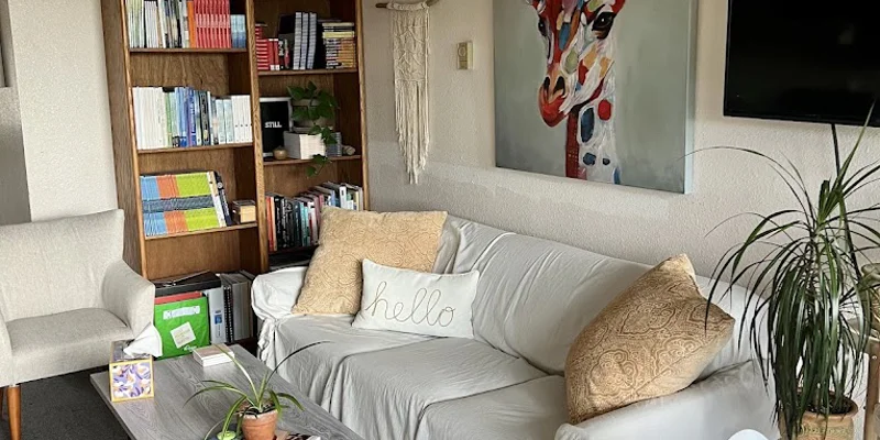 A reading and relaxation area with bookshelves and a sofa.