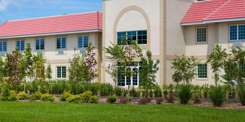 A close-up view of the rehab facility's entrance and landscaping
