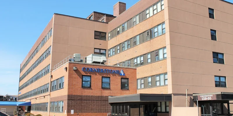 Exterior view of Cornerstone building with front and side entrance .