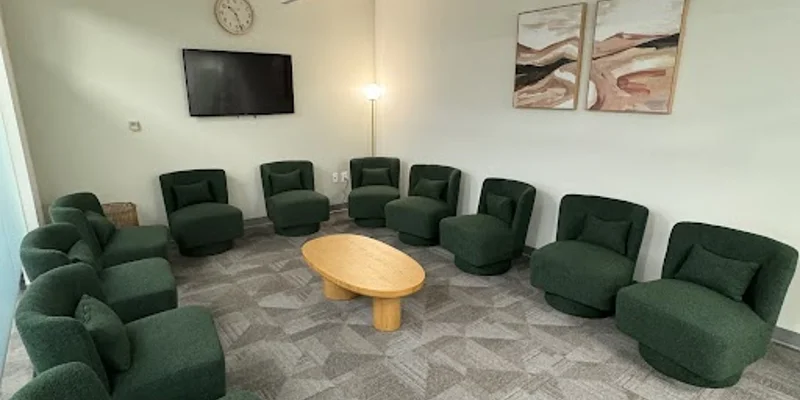 Circular seating area in a spacious therapy room.