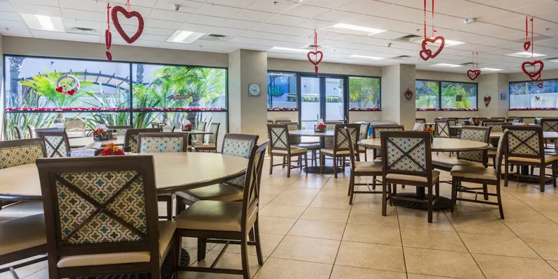  dining area with round tables, chairs, and heart-shaped decorations