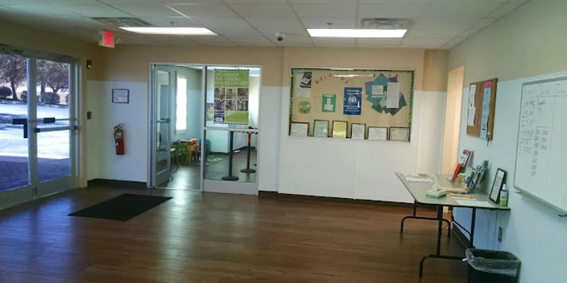 Lobby with bulletin boards and a table.