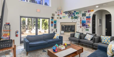 Lounge with sofas and a fireplace.