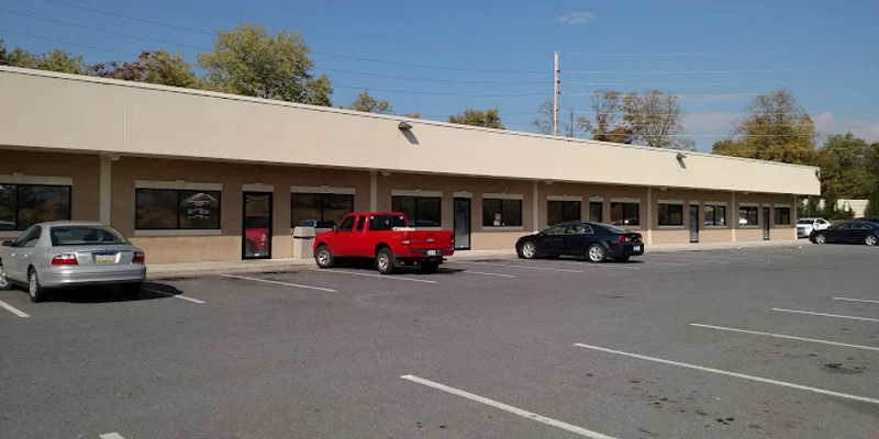 Facility exterior with entrance and accessible parking.