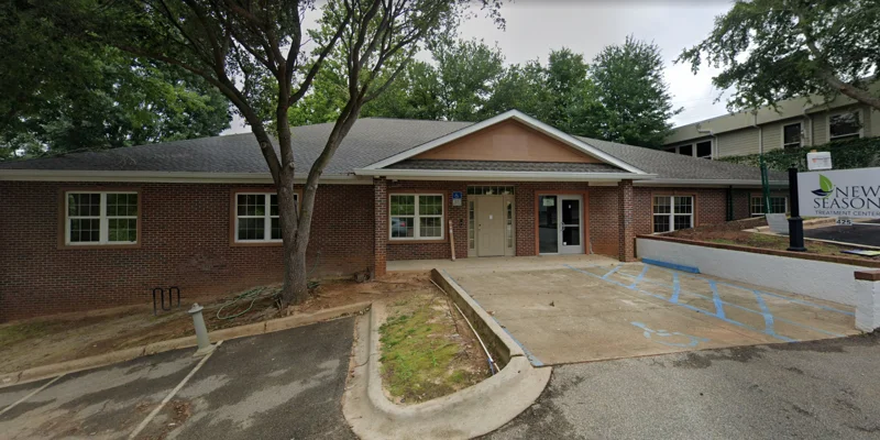 Facility exterior with signage and accessible parking.