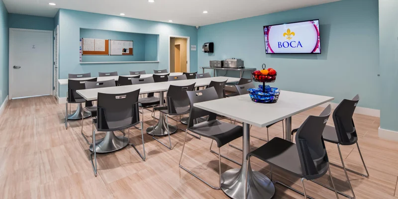 Dining area with tables, snacks, and a TV.