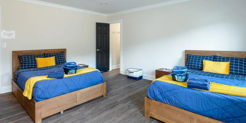 Shared bedroom with two beds.