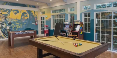 Game room with a pool table and foosball table.