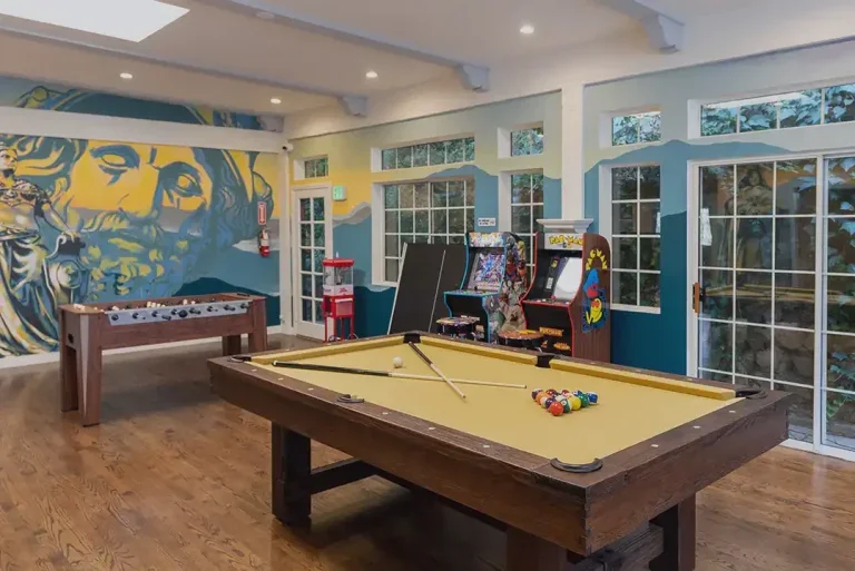 Game room with a pool table and foosball table.