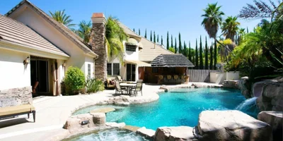 Backyard pool with seating.