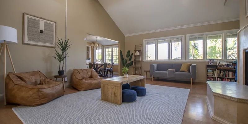A spacious living area with bean bags and modern decor.