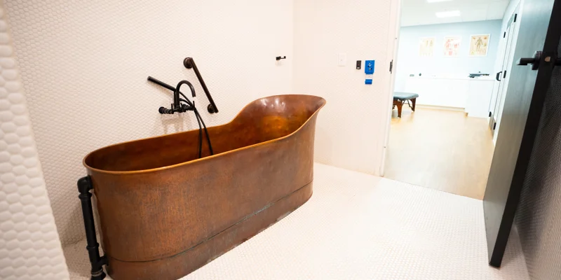Copper soaking tub in a private spa room
