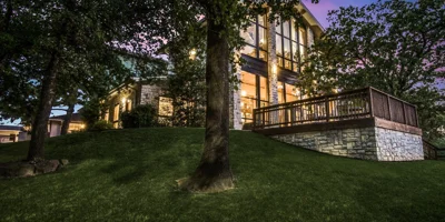 Rehab facility at night, surrounded by trees and soft lighting