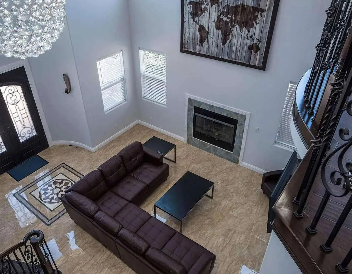 Living room with a sofa, and a fireplace.