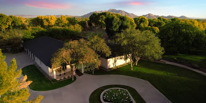 Aerial view of a scenic rehab facility with mountains.