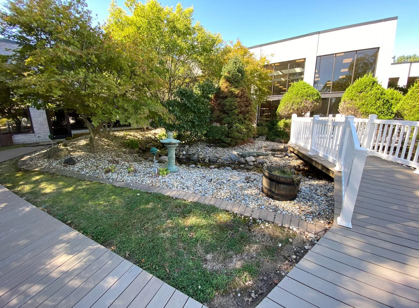Garden area with a small stone-lined creek.