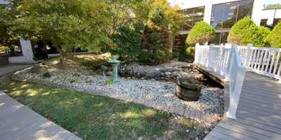 Garden area with a small stone-lined creek.
