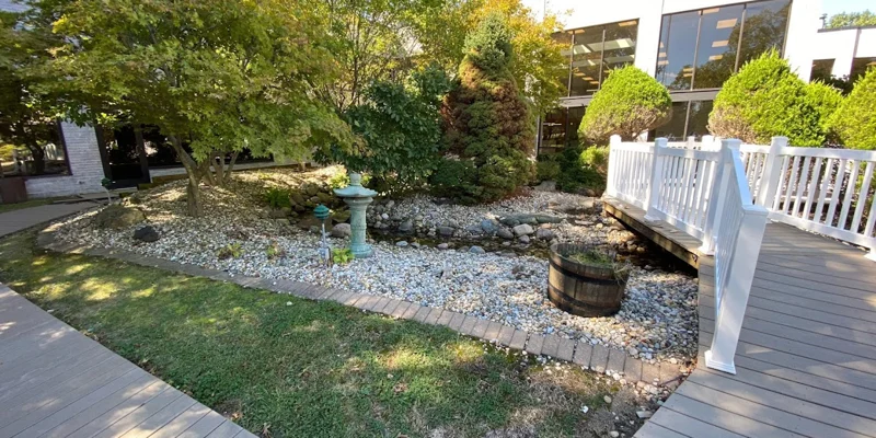 Garden area with a small stone-lined creek.