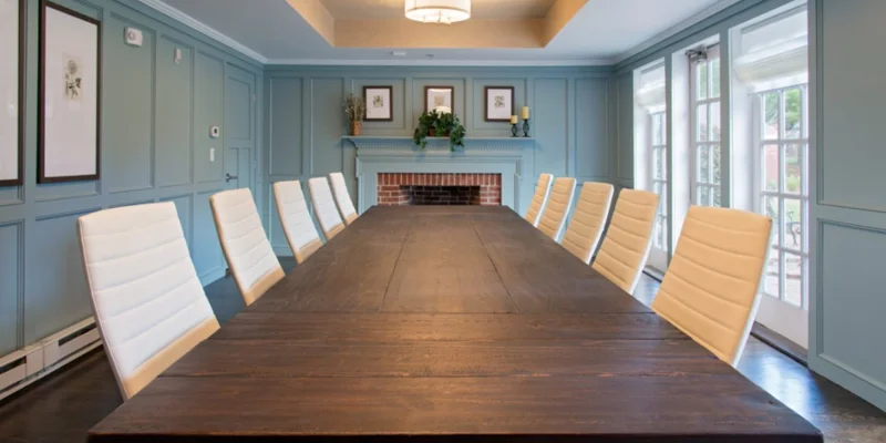 Conference room with a long table and chairs.