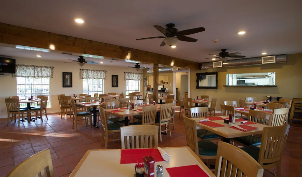 Dning area with tables and chairs.