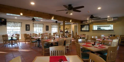 Dning area with tables and chairs.