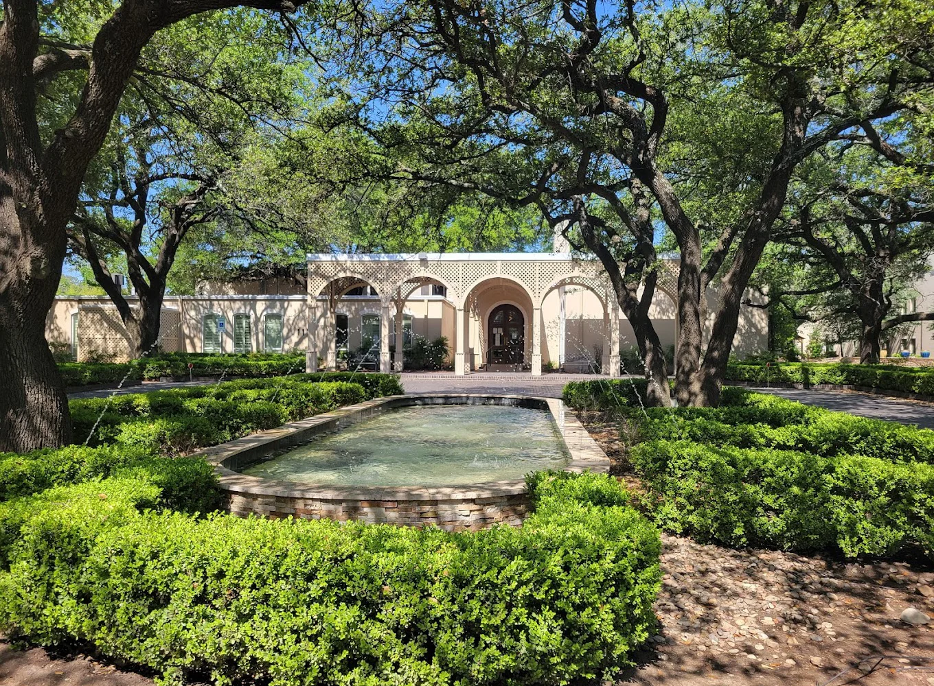 A landscaped courtyard with a water fountain.