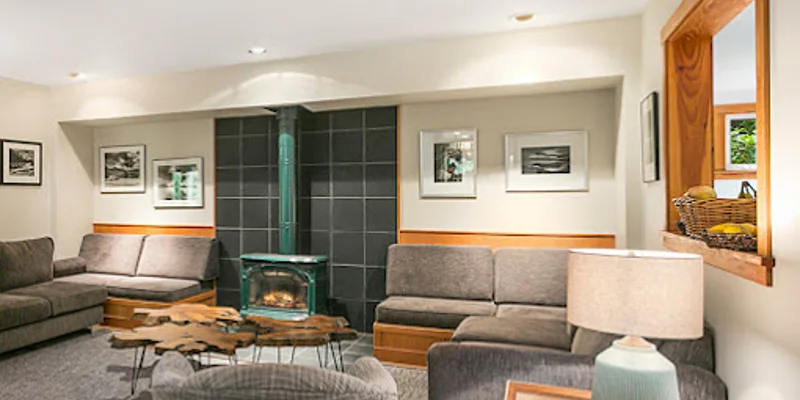 Lounge with sofas and a fireplace.