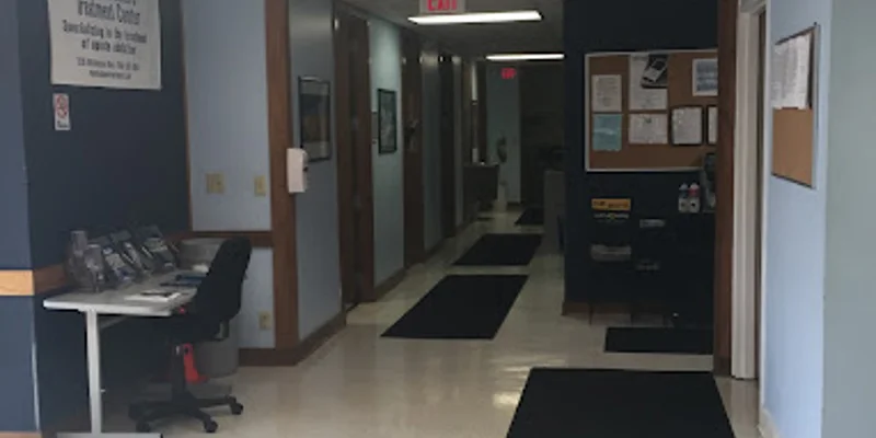 Hallway inside and an information desk near the entrance.