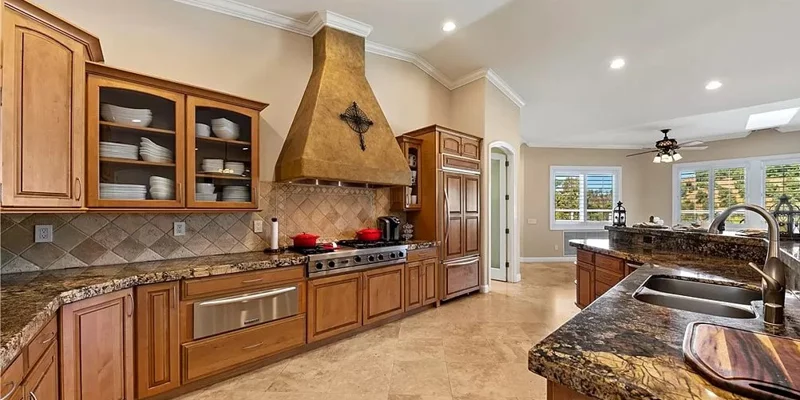 Kitchen with countertops, and a stove