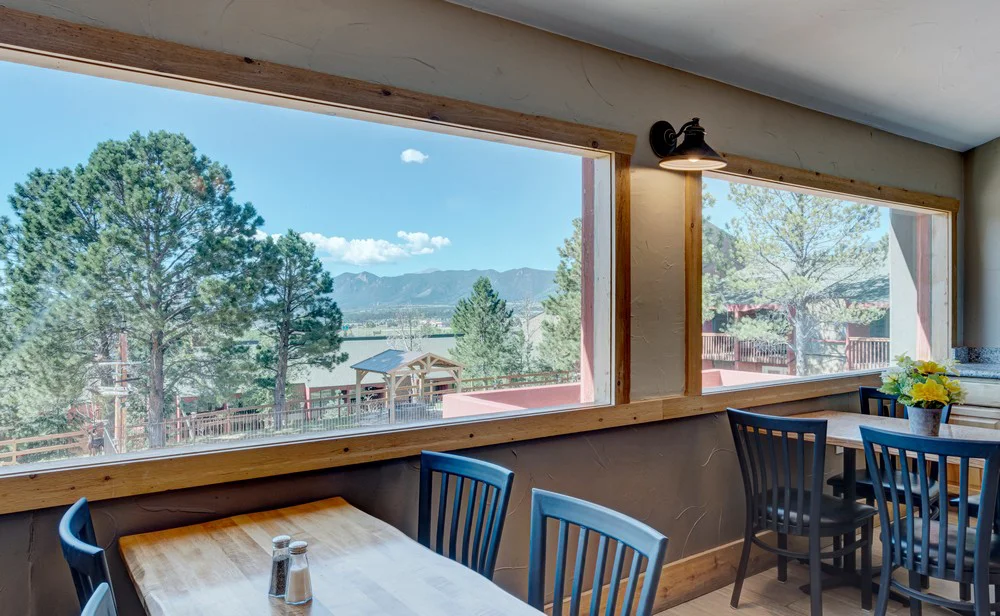 Dining area with tables and chairs.
