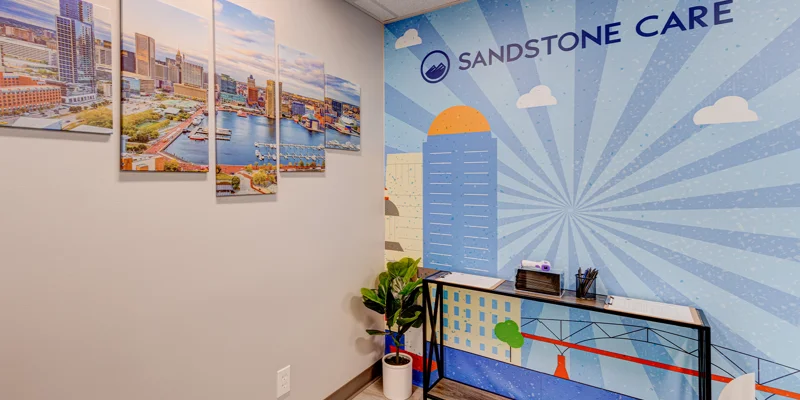Waiting area with signage on the wall.