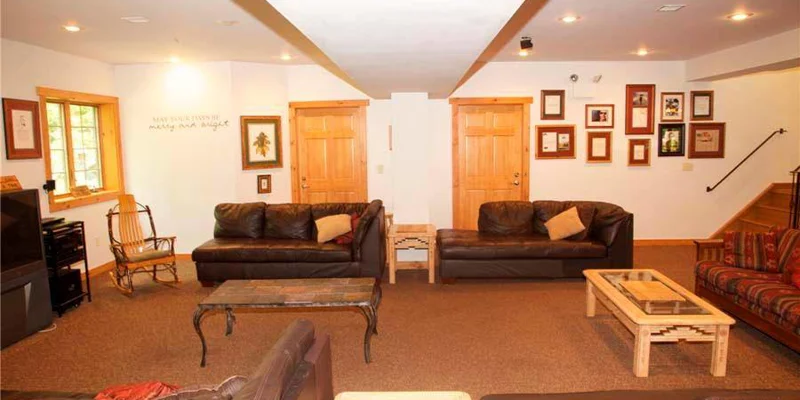 A warm and inviting shared lounge with leather sofas