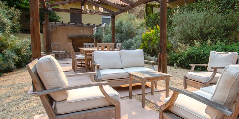 Courtyard with seating and a pergola.