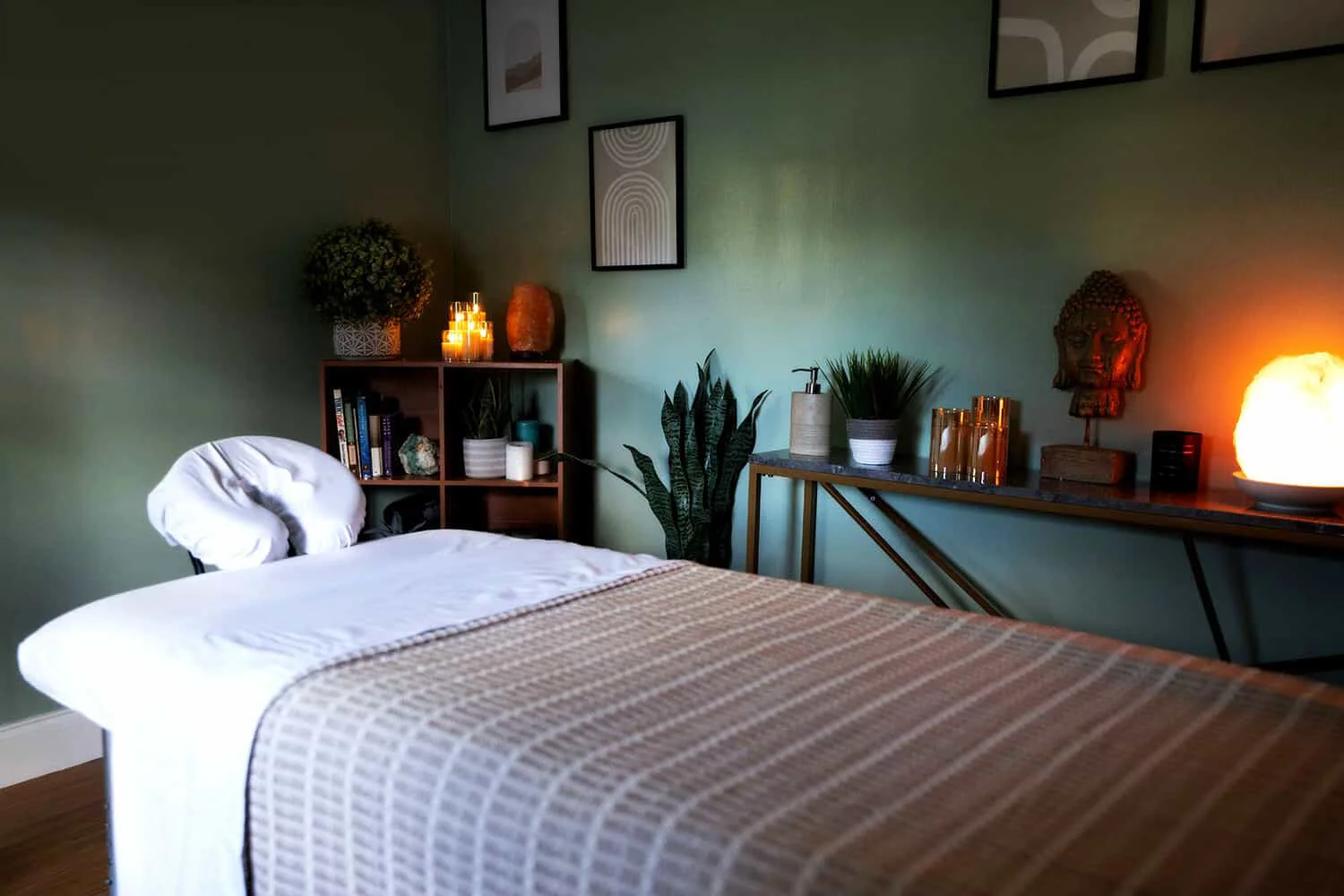 Tranquil massage room with soft lighting and decor.