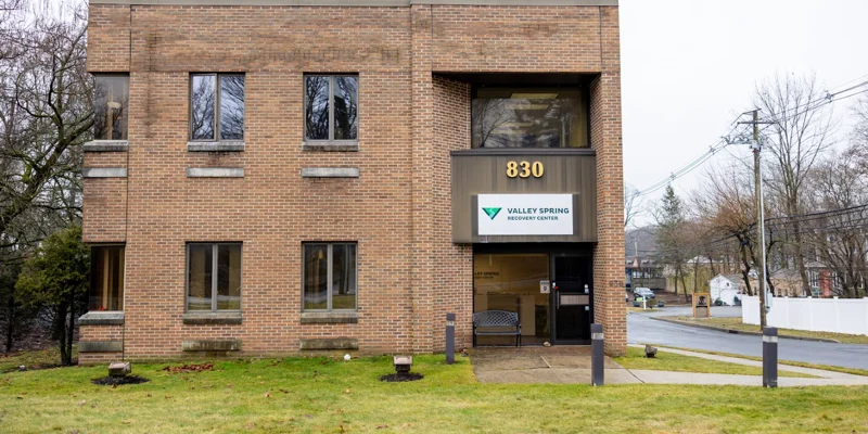 Facility exterior with signage at entrance.