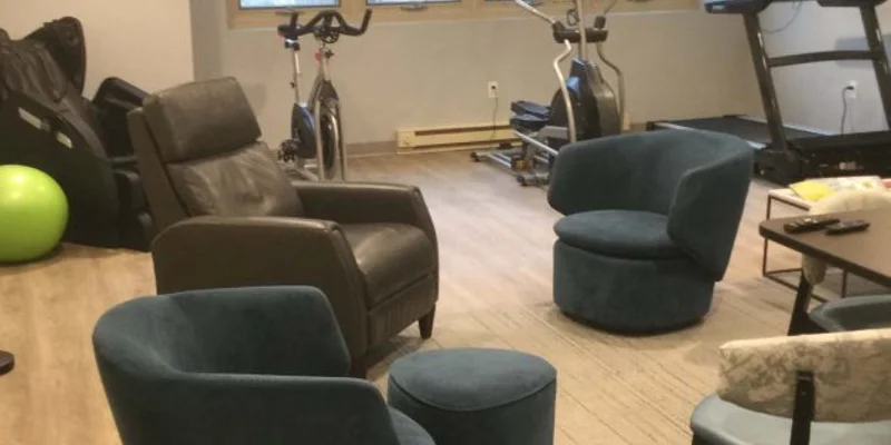 Exercise bikes and chairs in small therapy gym